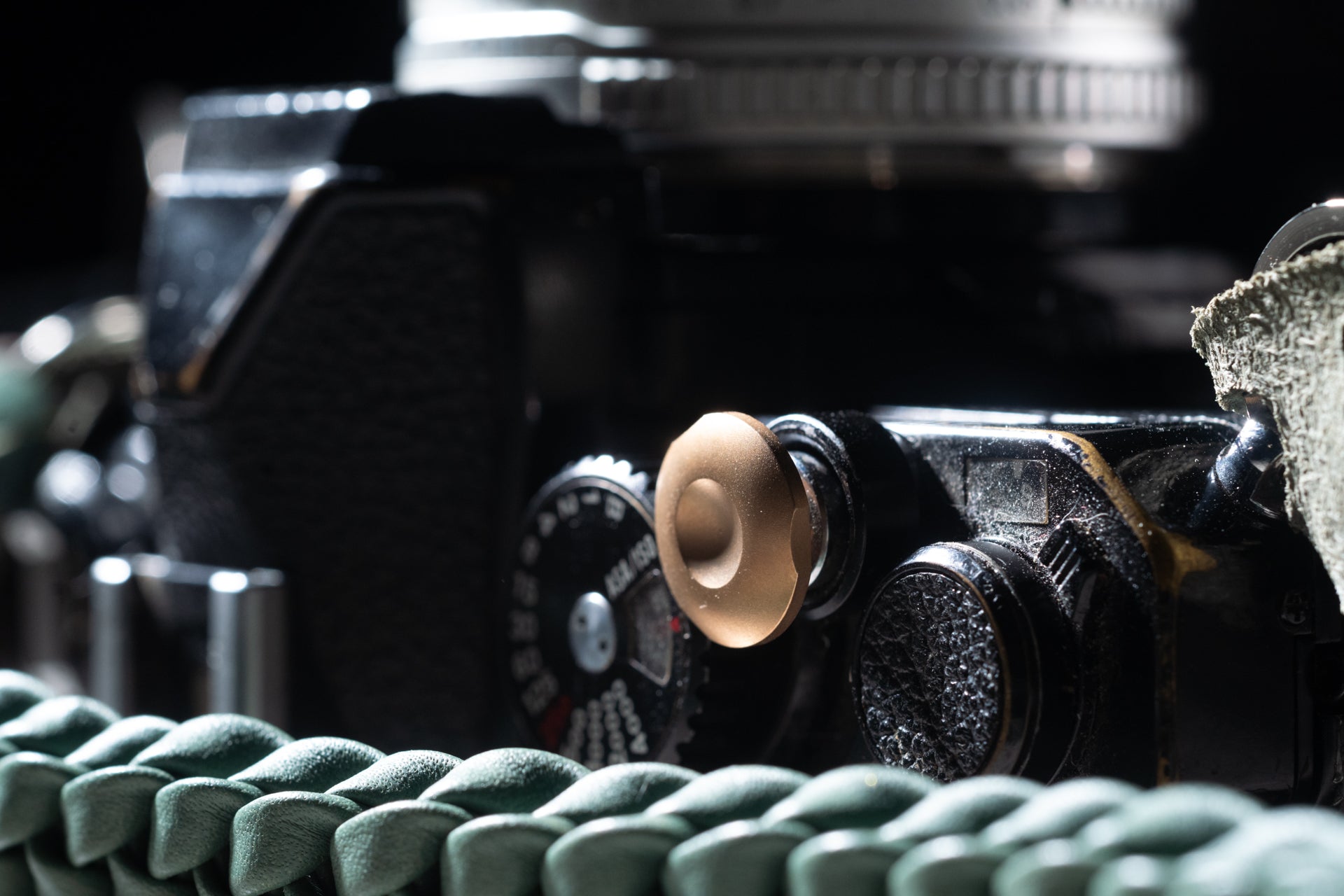 bronze shutter release button, by Komaru